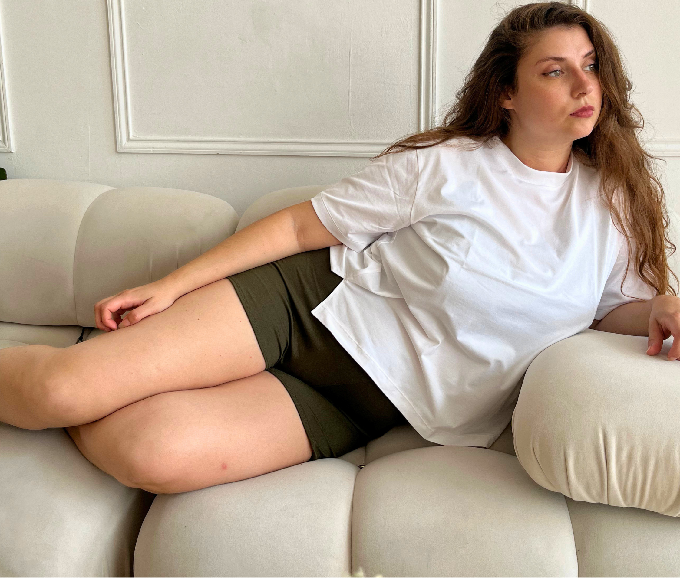 Woman wearing Cuurve cosy charlotte shorts made in yorkshire. Relaxing at home in comfort