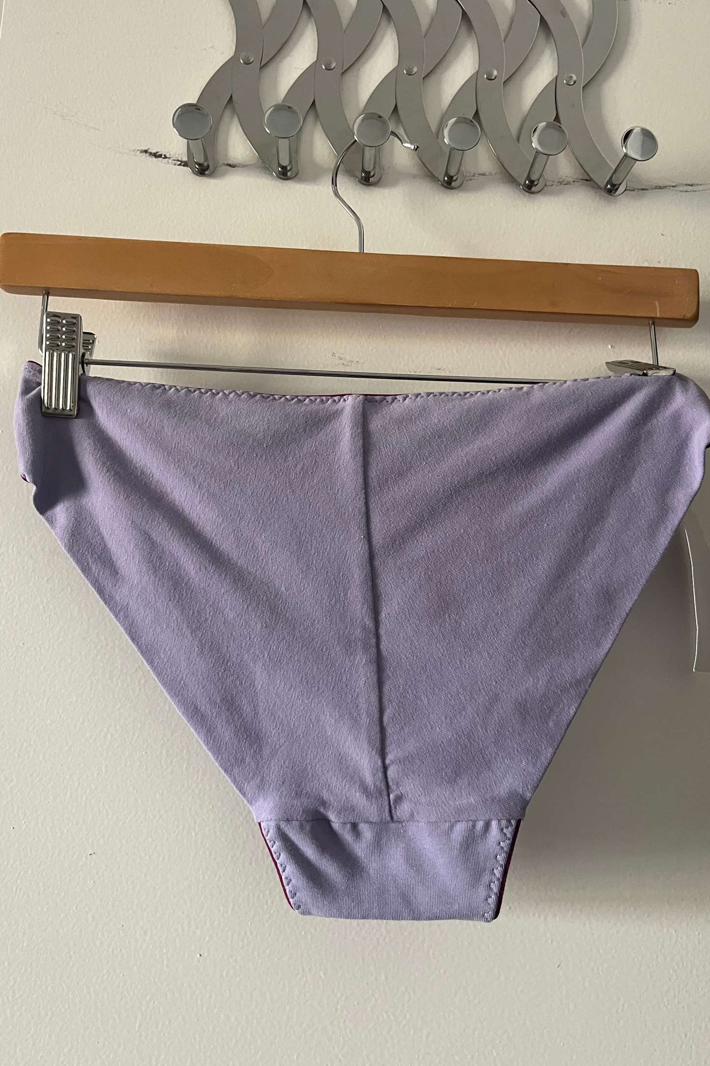 back view of the cinderella panty in lilac cotton jersey, showing the smooth fold-over finish without elastic for a gentle, seamless fit.