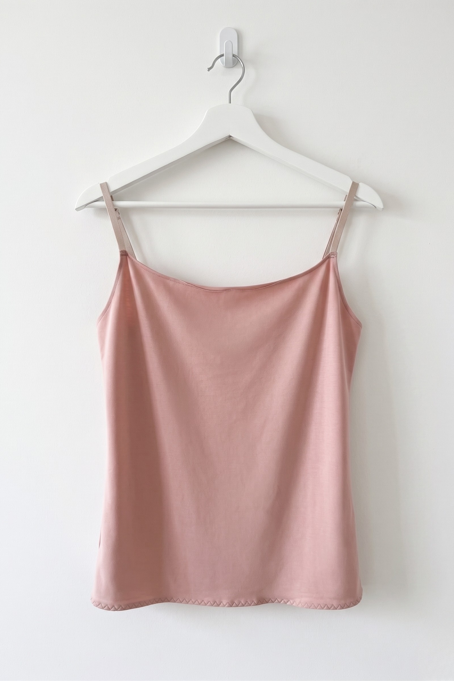 Cuurve Calm Clara cowl neck cami in Blush, soft modal jersey, hanging on white hanger against white wall