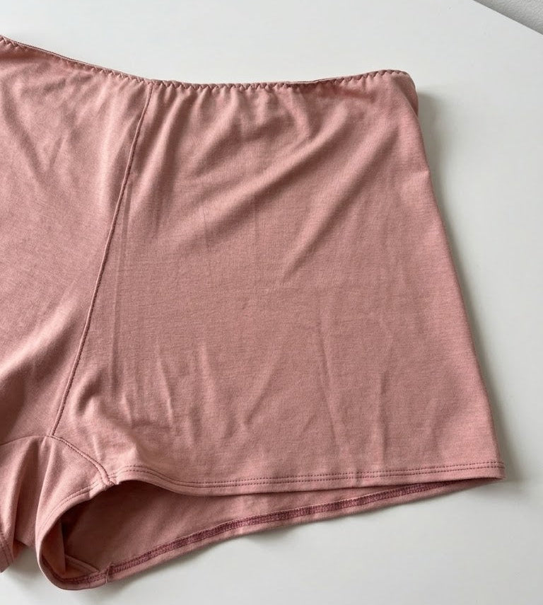 Cuurve Cosy Charlotte Shorts in Blush, close-up flat lay showing soft micromodal fabric texture and hem detail