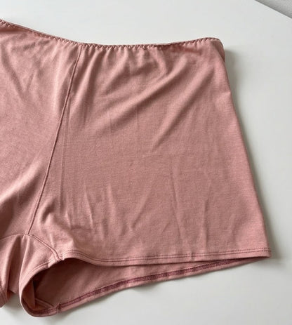 Cuurve Cosy Charlotte Shorts in Blush, close-up flat lay showing soft micromodal fabric texture and hem detail