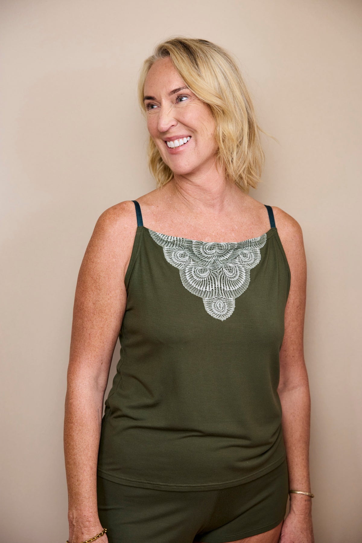 Model wearing the Cosy Charlotte Set: Dark Olive TENCEL™ Modal cami and shorts, photo 3
