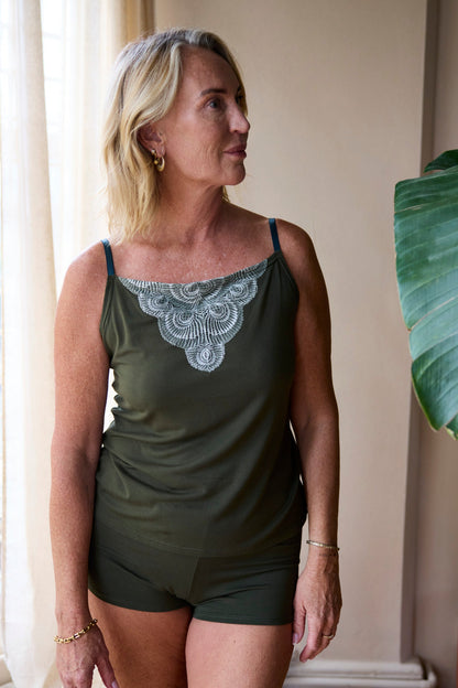 Model wearing the Cosy Charlotte Set: Dark Olive TENCEL™ Modal cami and shorts, photo 1