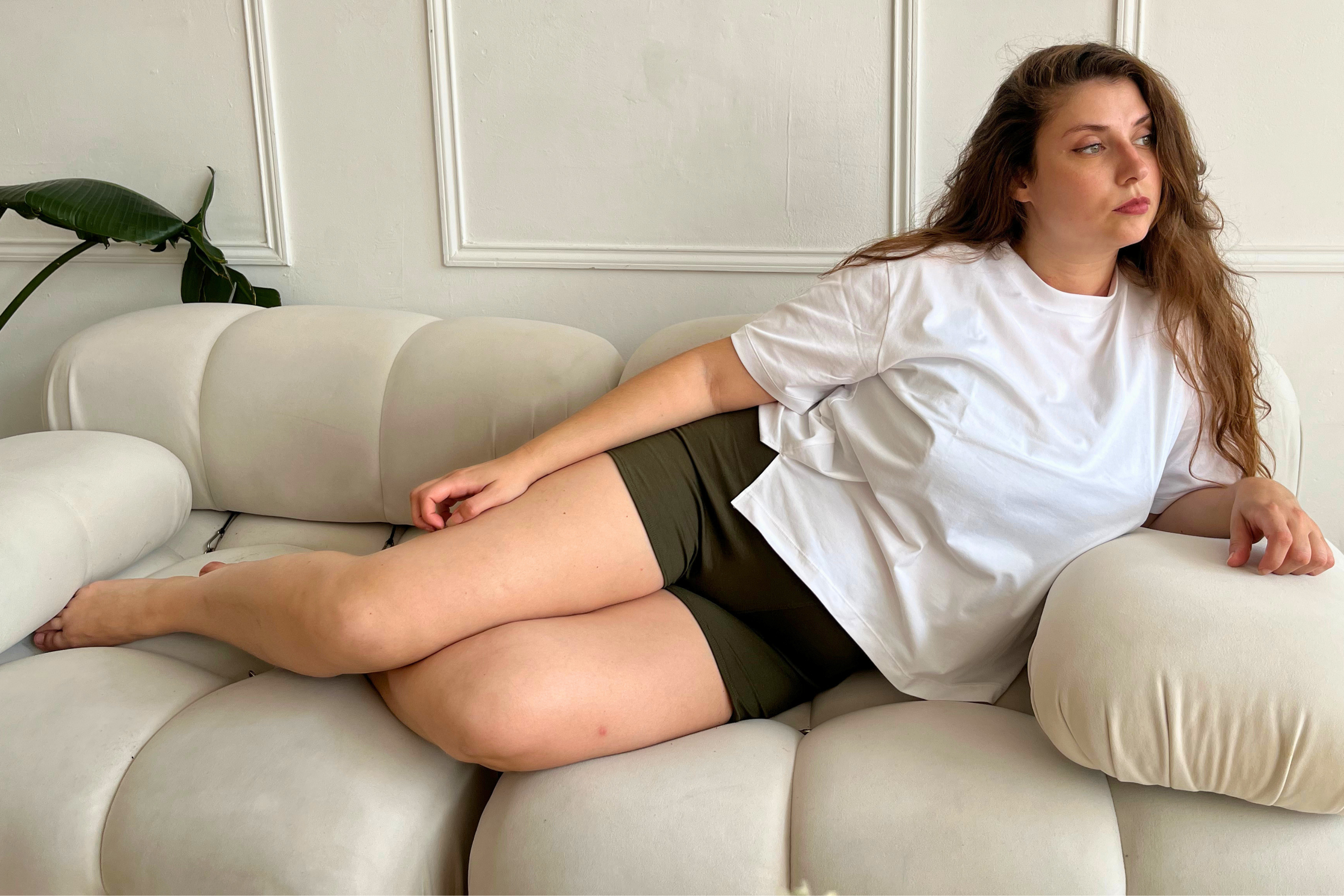 Woman wearing Cuurve cosy charlotte shorts made in yorkshire. Relaxing at home in comfort 