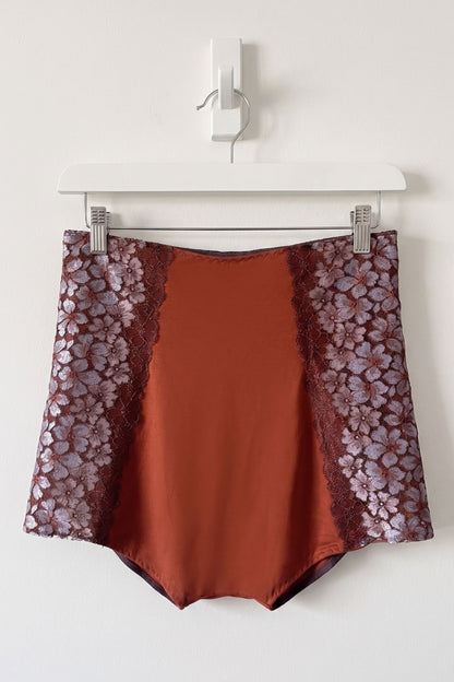 Brown high rise from micromodal with floral lace sleeves on a white hanger against a white background