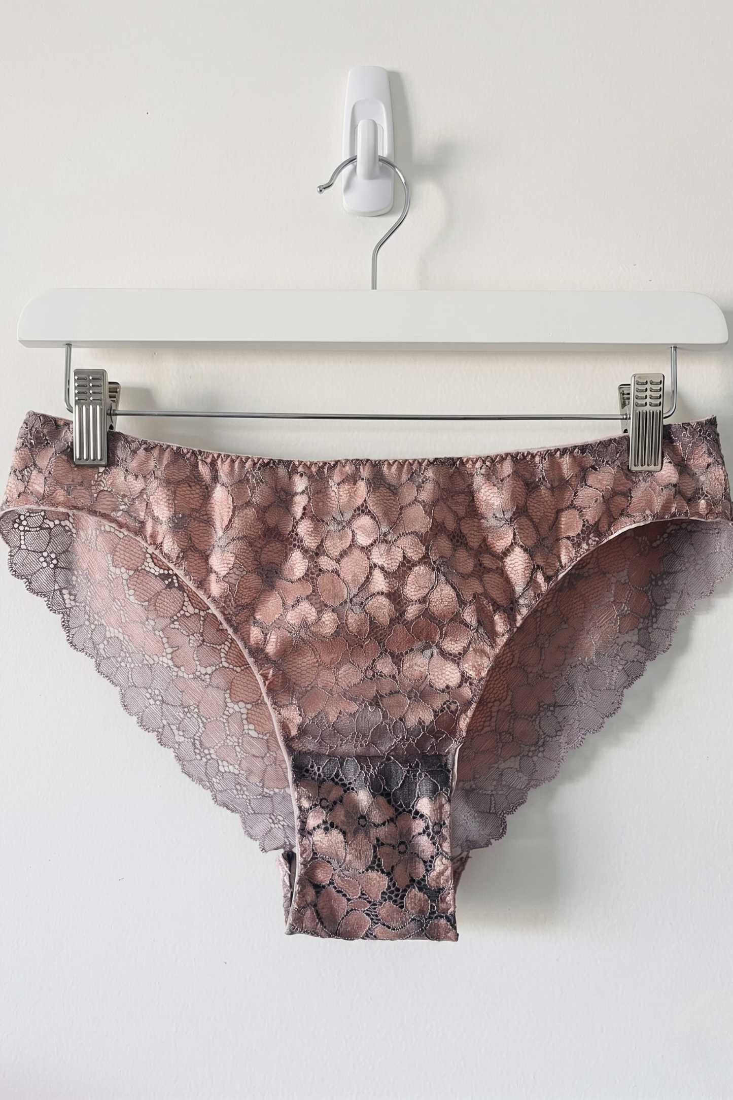 Patterned underwear on a hanger against a white background