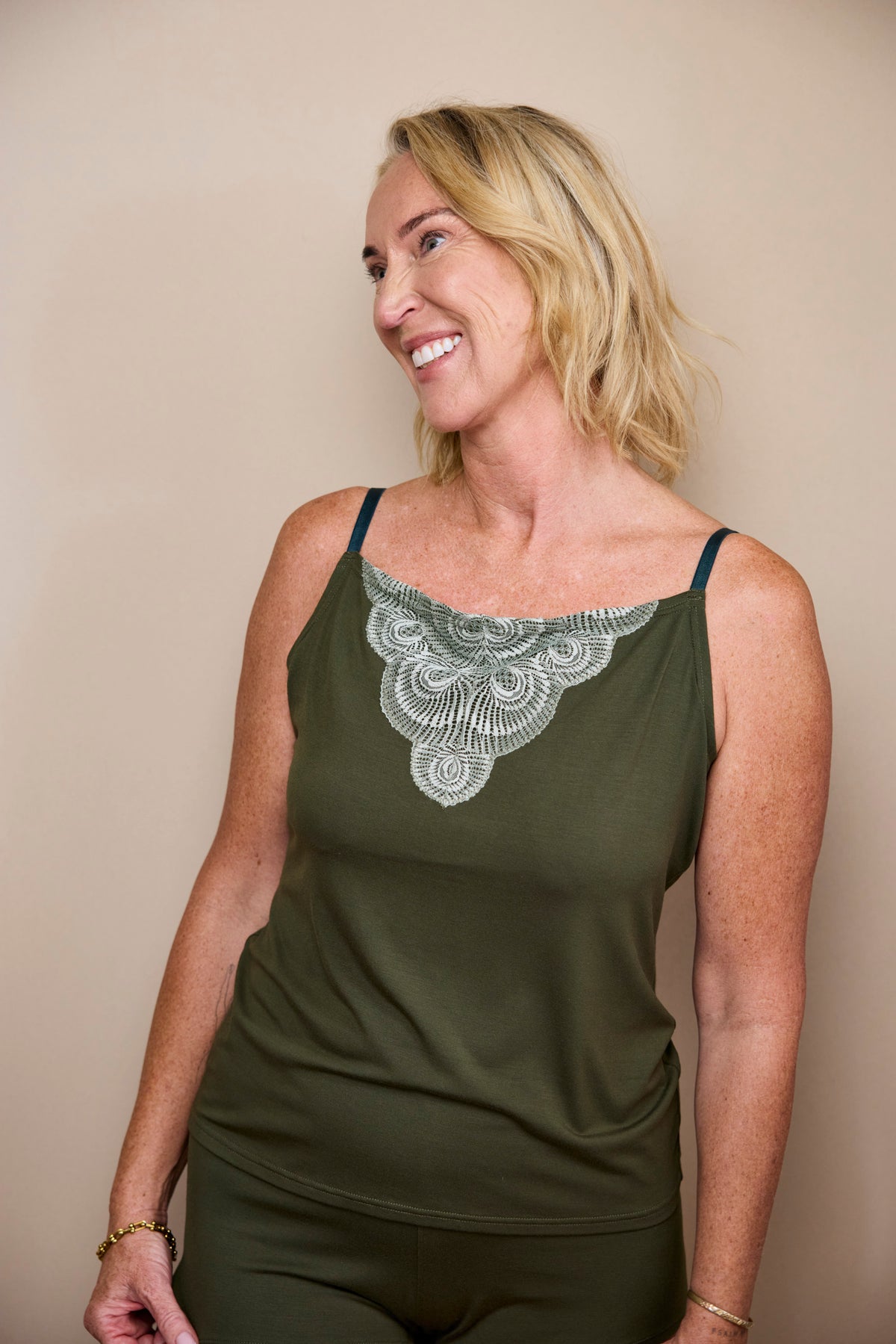 The Calm Clara Cami, a Dark Olive modal cowl-neck cami, lifestyle photo 1 of 6