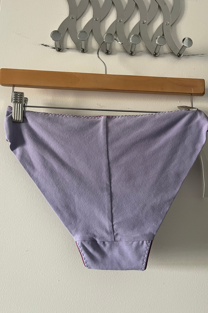 back view of the cinderella panty in lilac cotton jersey, showing the smooth fold-over finish without elastic for a gentle, seamless fit.