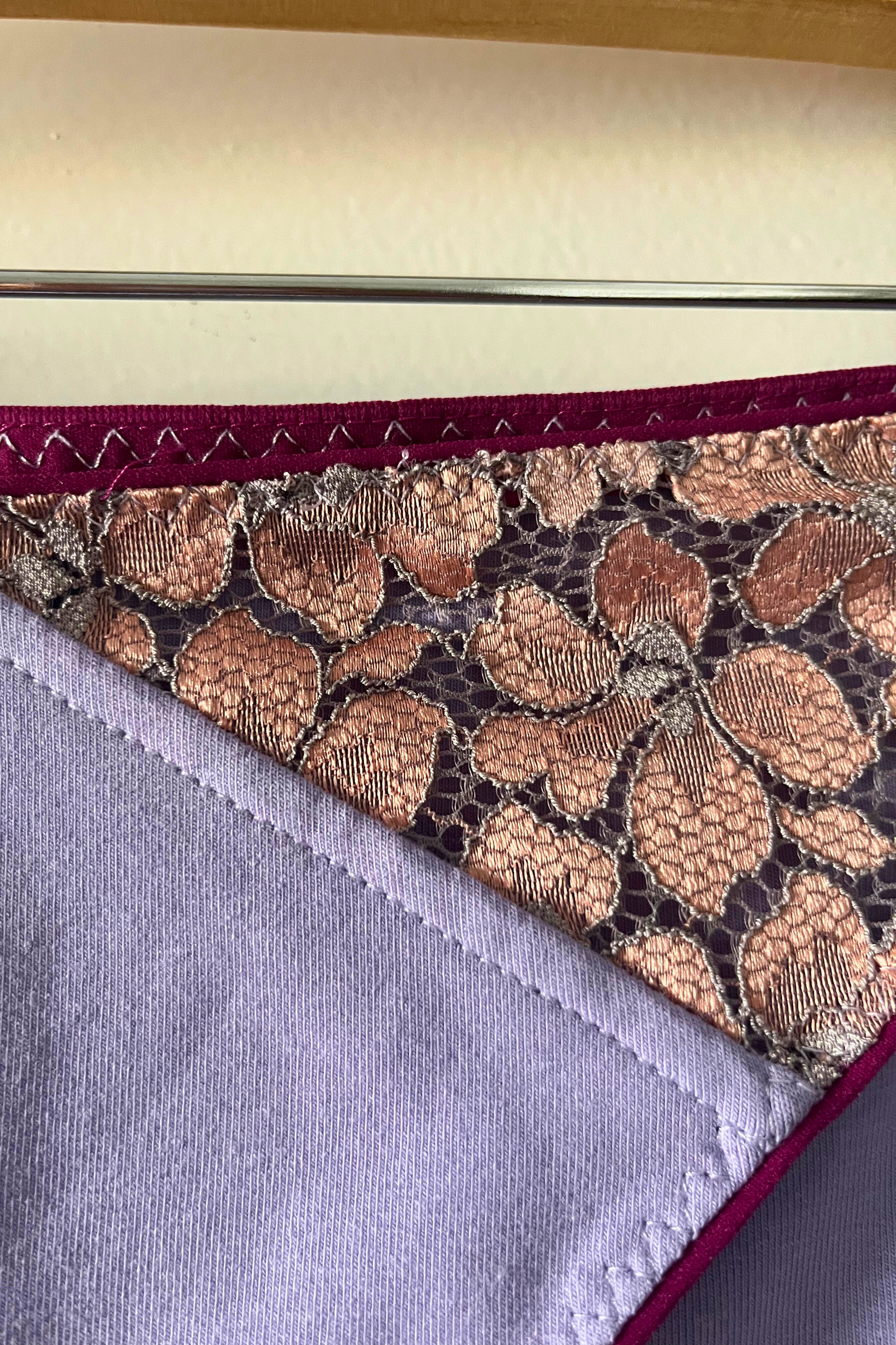 close-up of the metallic rose lace panel and bamboo jersey gusset on the cinderella panty, showing texture and stitching details