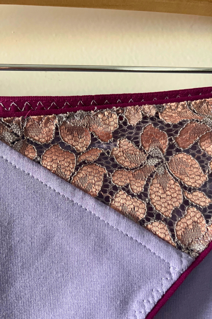 close-up of the metallic rose lace panel and bamboo jersey gusset on the cinderella panty, showing texture and stitching details
