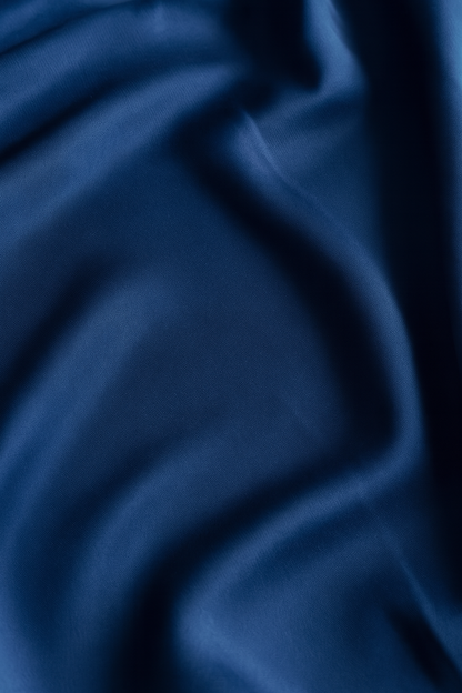 Close-up of deep navy Italian regenerated ECONYL® nylon, crafted from rescued ocean plastics for strength and durability.