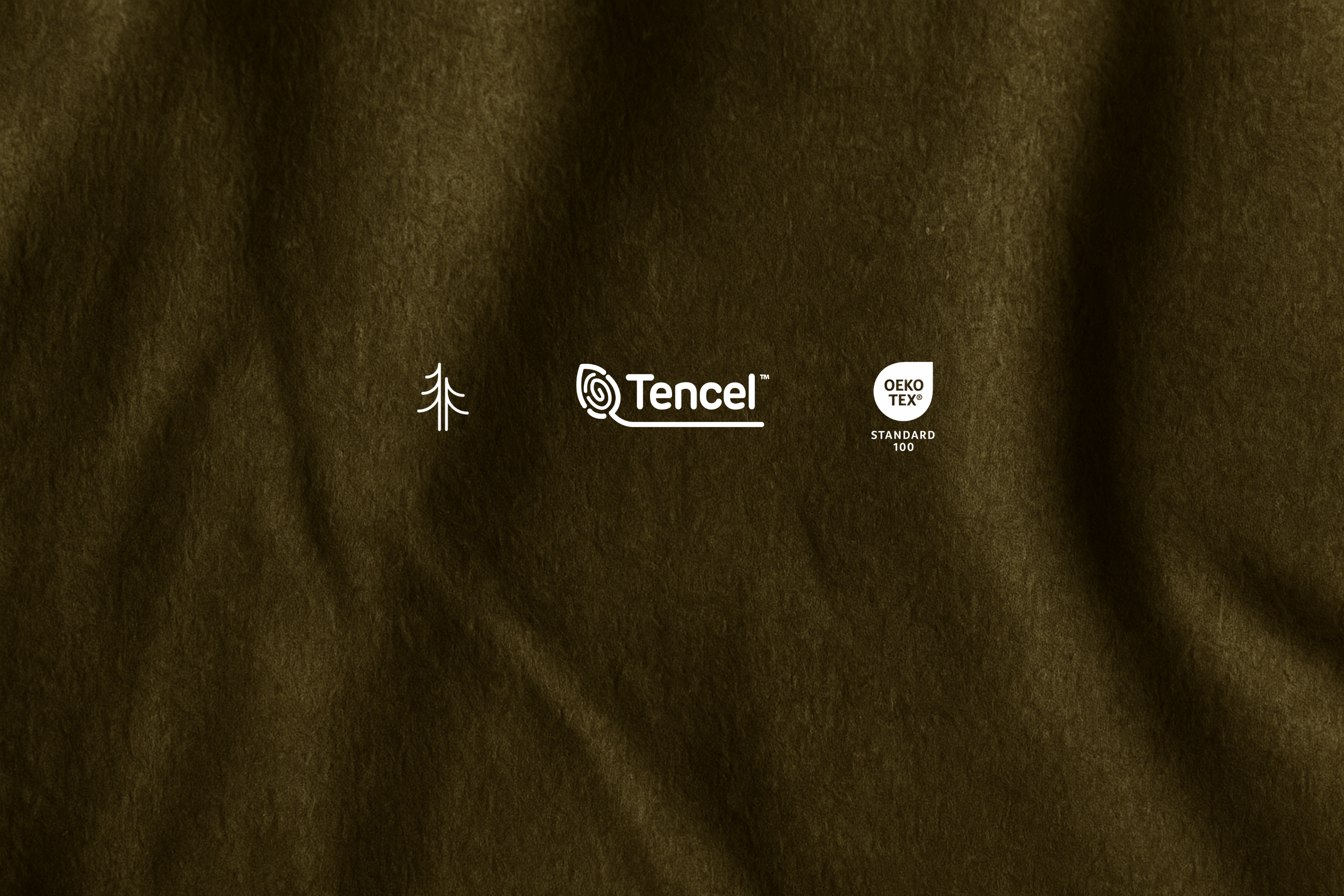 Close-up of olive green Micromodal fabric in soft natural light, showing gentle folds and a smooth, breathable texture. - certified fabrics with oeko tex standard 100 and tencel 