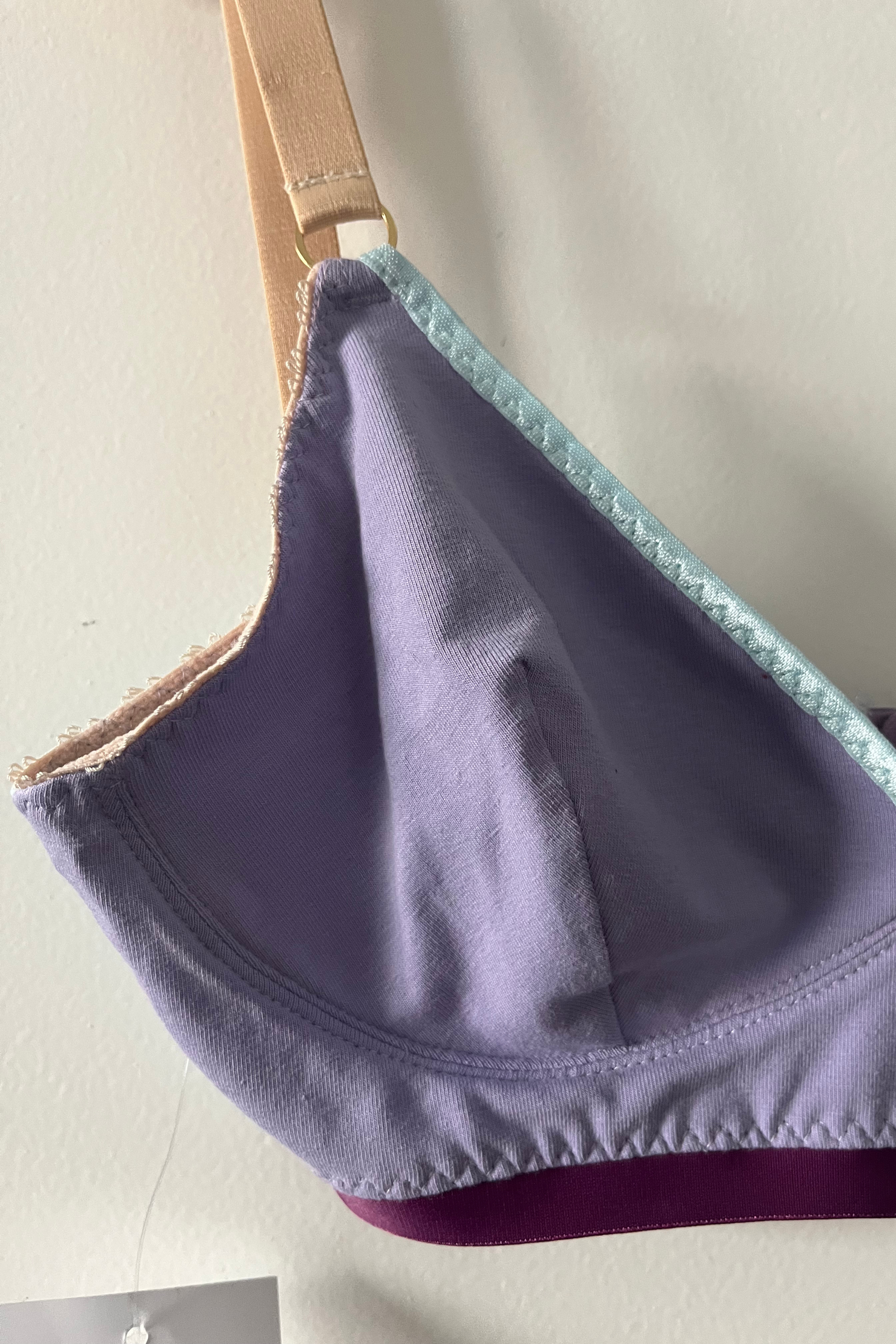 side detail of the bralette showing the aqua mesh side panel, cotton jersey cup and the wire-free channeling for added structure.