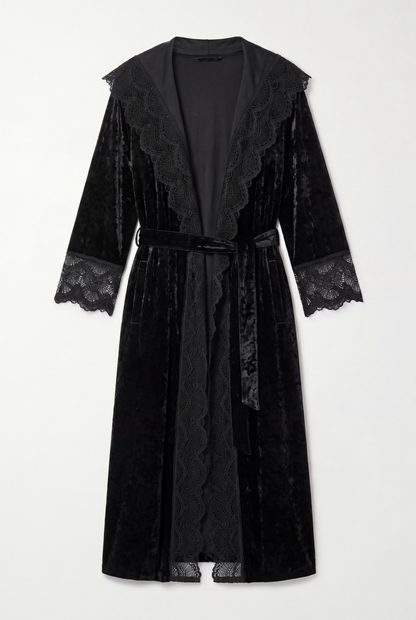 Front view of the black crushed velvet romantasy gown with lace-trimmed hood, front edges and cuffs, and a waist tie